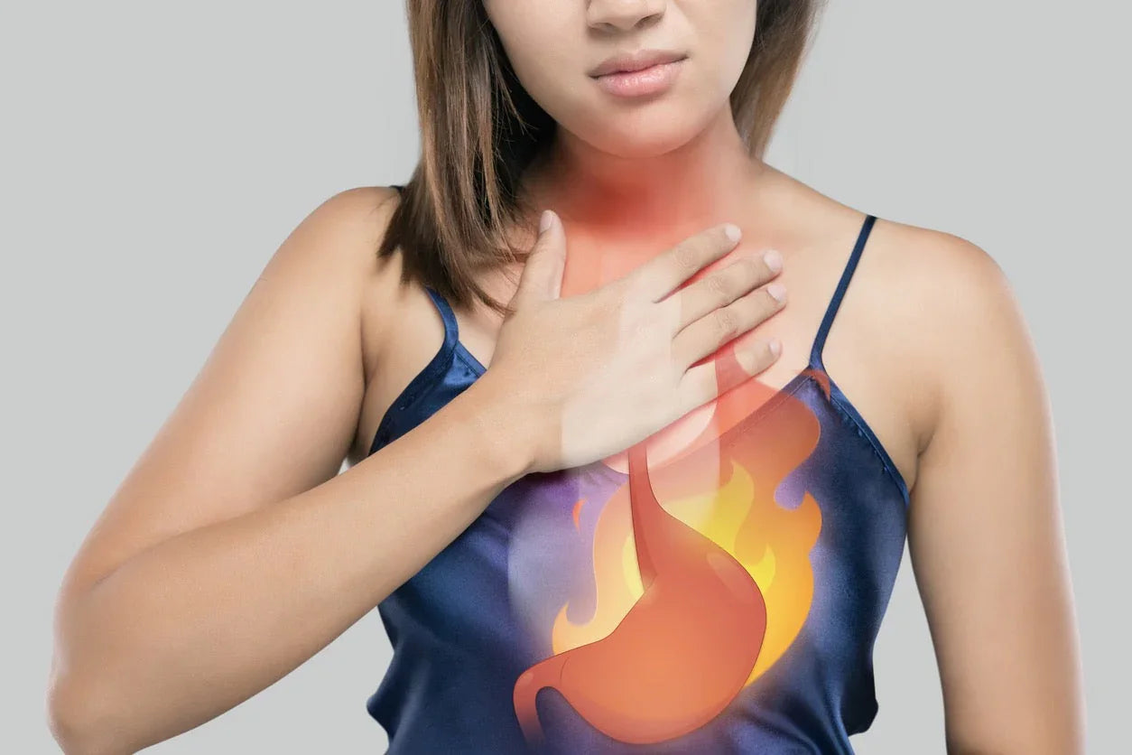 Woman holding chest, visualizing acid reflux or heartburn, digestive health concept